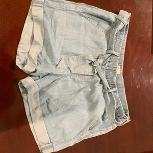 Hinge pull on elastic waist shorts with belt.